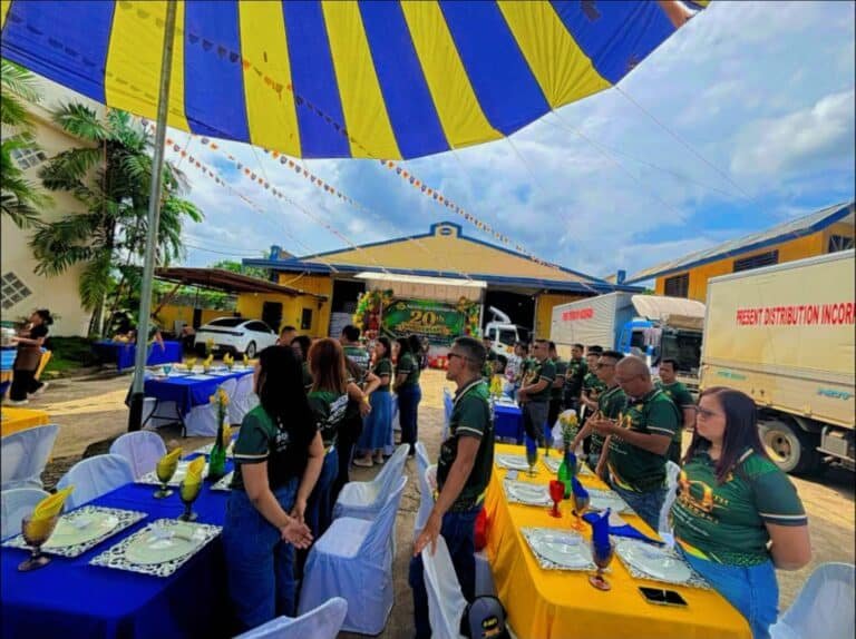 Cafe Esquinita catering setup for a corporate event with tables under colorful tents