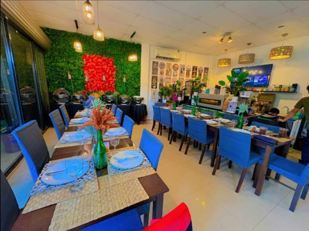 Home 4 Cafe Esquinita dining room set up for a private party with long tables and a buffet along the wall